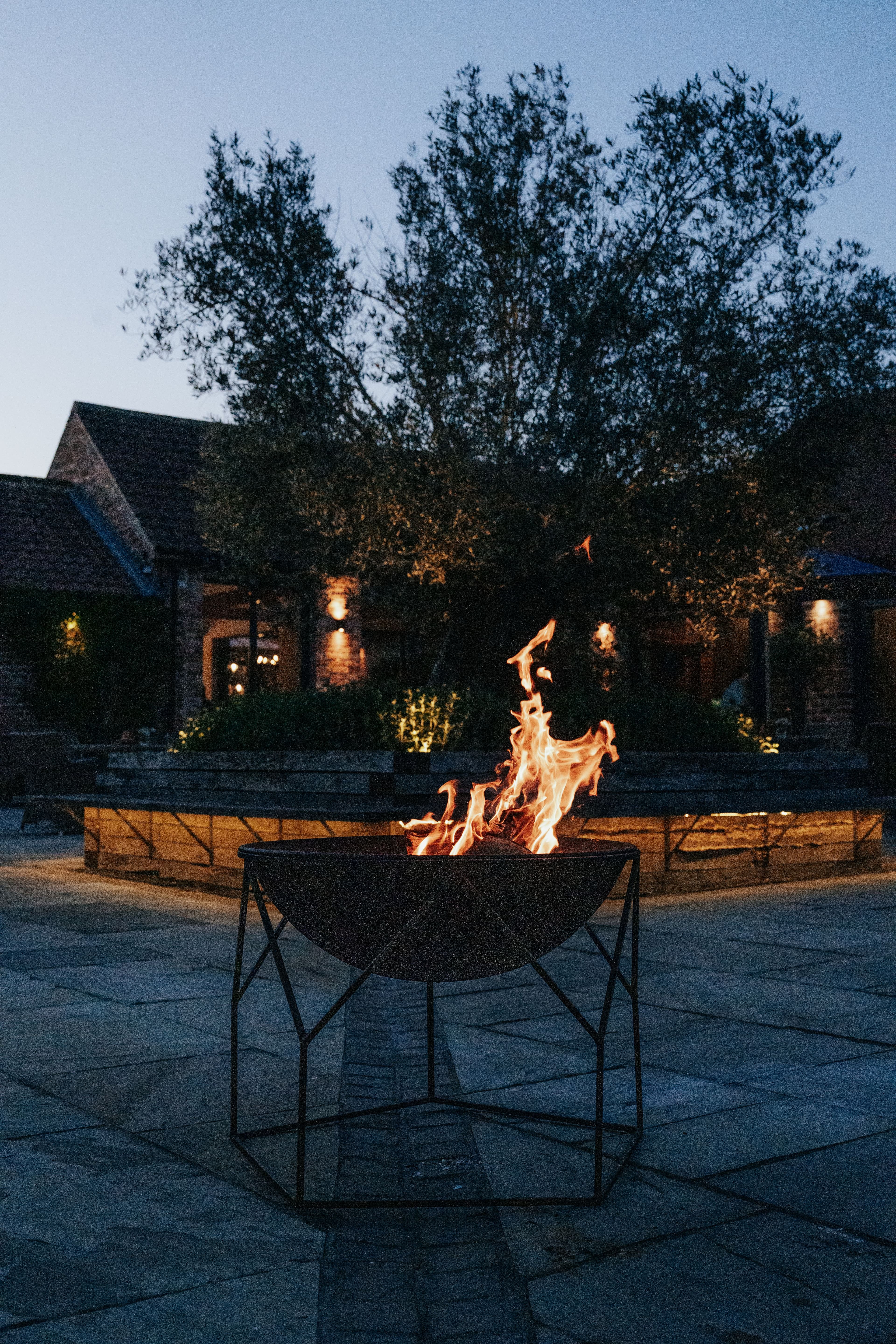 Winter in the courtyard with firepits lit creating a warming reception at Thirsk Lodge Barns